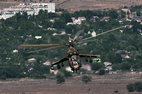 Attack helicopter Mi-35P in flight, view from a parallel helicopter (export v Stock Photos