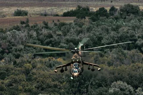 Attack helicopter Mi-35P in flight, view from a parallel helicopter (export v Stock Photos