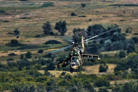 Attack helicopter Mi-35P in flight, view from a parallel helicopter (export v Stock Photos