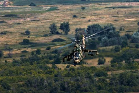 Attack helicopter Mi-35P in flight, view from a parallel helicopter (export v Stock Photos