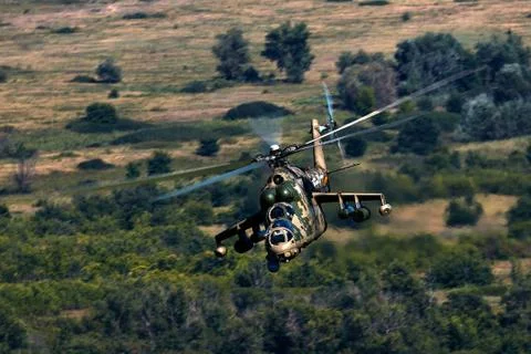 Attack helicopter Mi-35P in flight, view from a parallel helicopter (export v Stock Photos