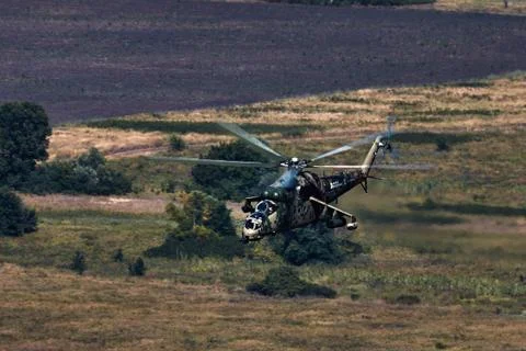 Attack helicopter Mi-35P in flight, view from a parallel helicopter (export v Stock Photos