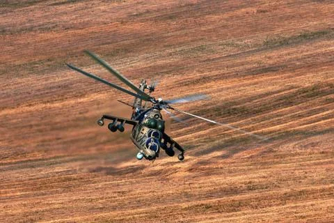 Attack helicopter Mi-35P in flight, view from a parallel helicopter (export v Stock Photos