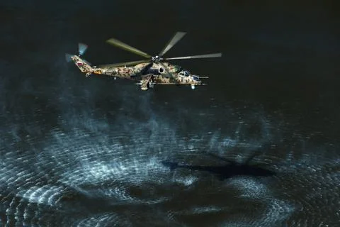 Attack helicopter Mi-35P in flight, view from a parallel helicopter (export v Stock Photos