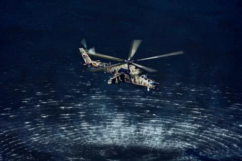 Attack helicopter Mi-35P in flight, view from a parallel helicopter (export v Stock Photos