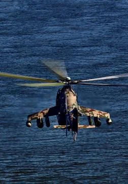 Attack helicopter Mi-35P in flight, view from a parallel helicopter (export v Stock Photos