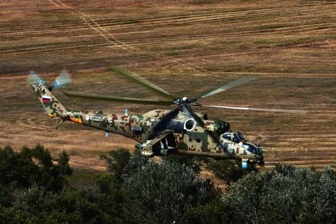 Attack helicopter Mi-35P in flight, view from a parallel helicopter (export v Stock Photos