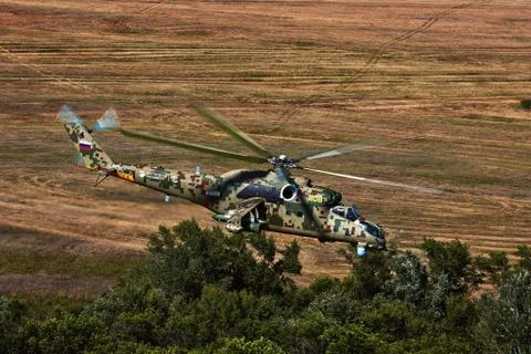 Attack helicopter Mi-35P in flight, view from a parallel helicopter (export v Stock Photos