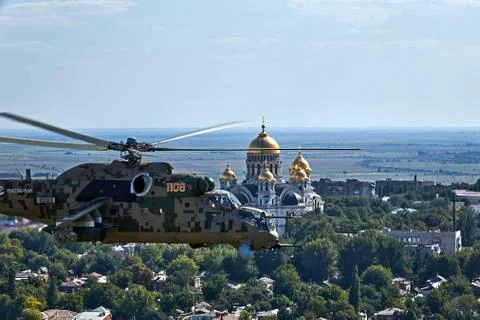 Attack helicopter Mi-35P in flight, view from a parallel helicopter (export v Stock Photos