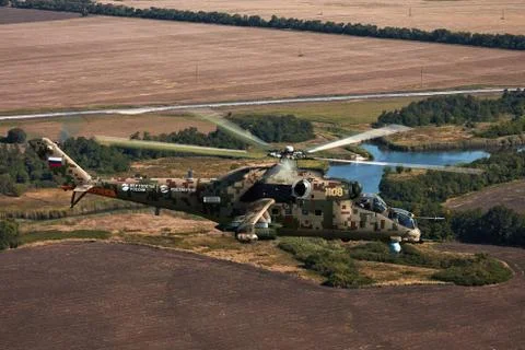 Attack helicopter Mi-35P in flight, view from a parallel helicopter (export v Stock Photos