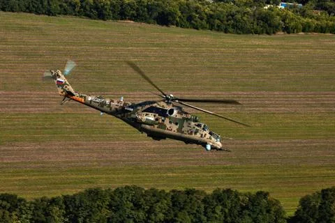 Attack helicopter Mi-35P in flight, view from a parallel helicopter (export v Stock Photos