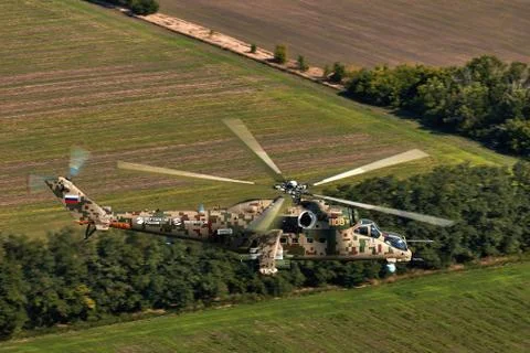 Attack helicopter Mi-35P in flight, view from a parallel helicopter (export v Stock Photos