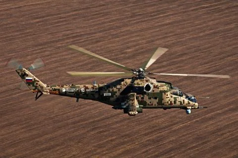 Attack helicopter Mi-35P in flight, view from a parallel helicopter (export v Stock Photos