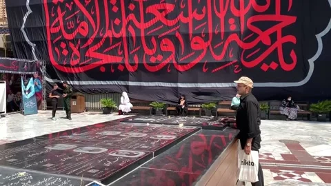 Attack on Rushdie, from religious blessing to indifference in Iran, Tehran, IR - Video stock 204707379