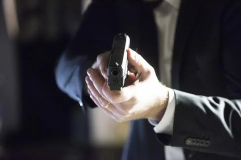 An attacker with a gun Stock Photos