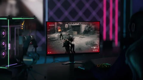 Attacking the npc zombie enemies in the level of a digital shooter simulator Stock Footage 246829474