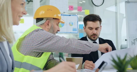 Attantive good-looking skilled bearded head chief listening the explanation Stock Footage 145600454