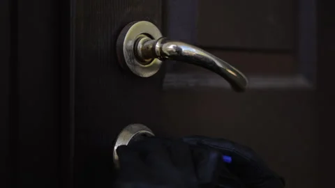  Attempting to Pick the Door Lock, which raises significant security concerns Video stock 316905556