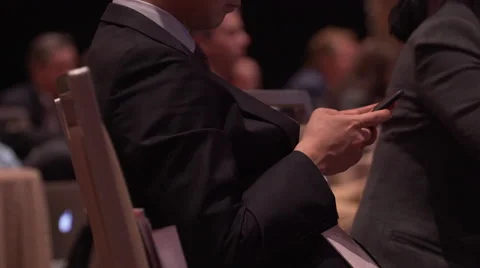 Attendee using phone at a conference Stock Footage 62415732