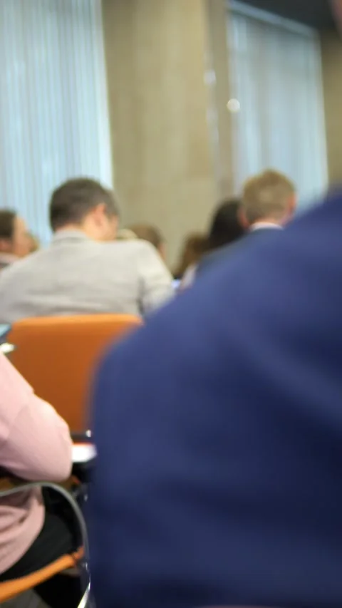 Attendees Actively Engaged at a Professional Conference for Meaningful Stock Footage 285948304