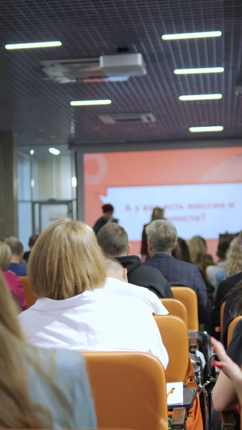 Attendees Actively Participating in a Conference Presentation Session Focused on Stock Footage 284908731