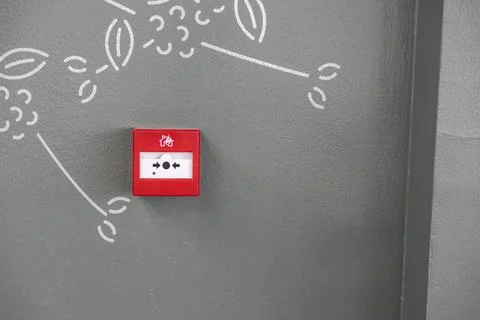Attention. Close up view of button fire alarm. Greece. Foto stock
