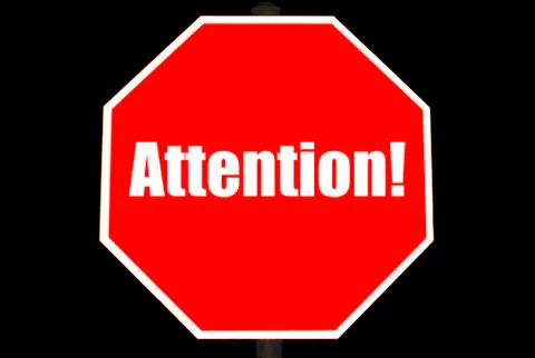 Attention concept on a stop sign Stock Illustration