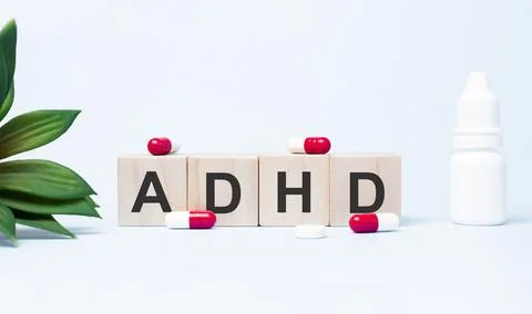 Attention deficit hyperactivity disorder. Text abbreviation on wood cubes blo Stock-Fotos