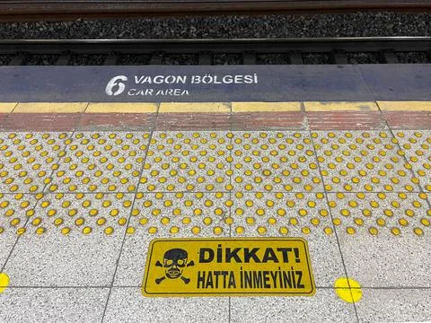 Attention! Do not get on the train line. Danger sign. Stock Photos