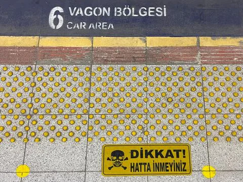 Attention! Do not get on the train line. Danger sign. Stock Photos