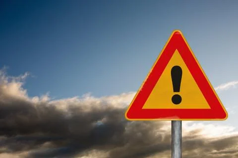 Attention road sign on a background with a dramatic sky Фото