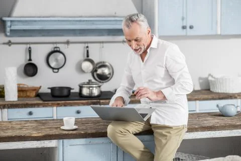 Attentive bearded man checking his email Stock Photos