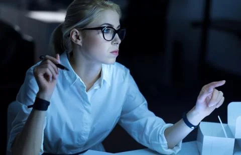 Attentive hacker executing the order in the office 스톡 사진