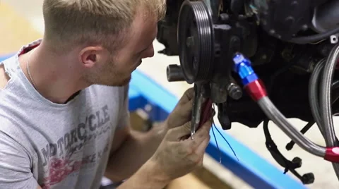 Attentive mechanic inspect the car engine Video stock 68012433