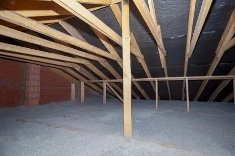 The attic has cellulose insulation. Made from recycled paper Stock Photos