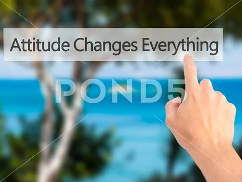Attitude Changes Everything - Hand pressing a button on blurred Stock Photos