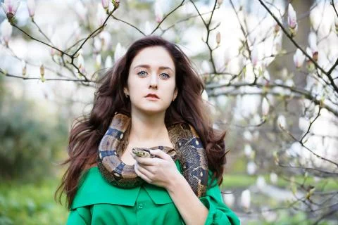 Attracrive girl with python Stock Photos