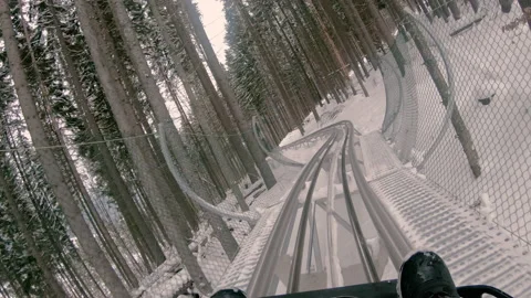 Attraction. Riding down a steep hill on a rodelbahn. Stock Footage 154578816
