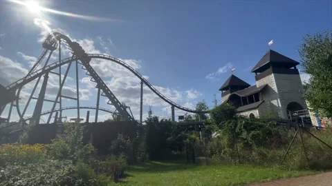 Attraction roller coaster against the background of the summer blue sky Stock Footage 171027806