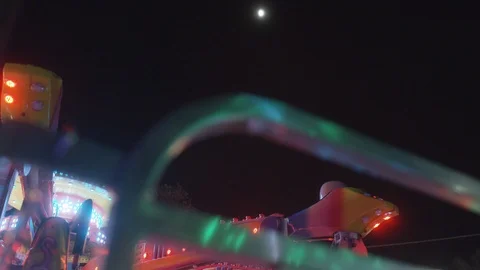 Attractions Package 22 | handheld moon carousel attractions park view shot Stock Footage 118710922