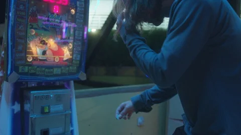 Attractions Package 5 | man boy guy inserts a coin in carousel punching bag game Stock Footage 118710359