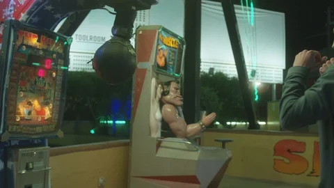 Attractions Package 6 | man boy guy punching hard attractions punching bag game Stock Footage 118710360