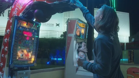 Attractions Package 8 | man activates punches hard attractions punching bag game Stock Footage 118710390