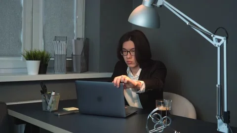 Attractiv Asian Man Typing Working at the Office Concentratedly Making Note Stock Footage 148365633