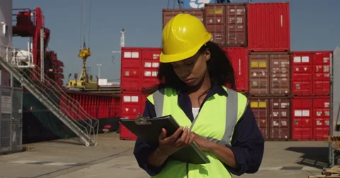 An attractive African American manager checking logistics at a shipyard. Stock Footage 55020928