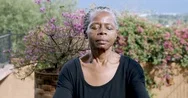 Attractive African American Senior Woman Meditating Outdoors Stock Footage