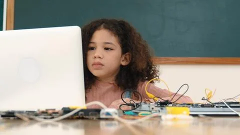 Attractive african student programing system while looking at screen. Pedagogy. Stock-Fotos