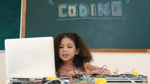 Attractive african student programing system while looking at screen. Pedagogy. Stock-Fotos