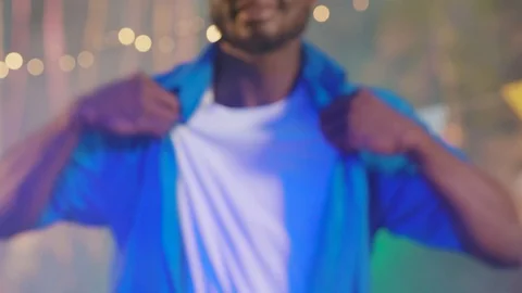 Attractive afro-american boy dancing with cool moves enjoying club music in Stock Footage 115354763
