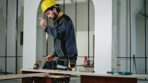 Attractive and excited constructor worker at construction site working Video stock 191534772